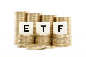 a stack of gold coins with the letters e, t, f on top
