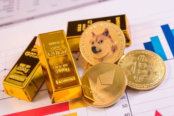 Gold Bars, bitcoin, ethereum, litecoin and dogecoin on a chart.
