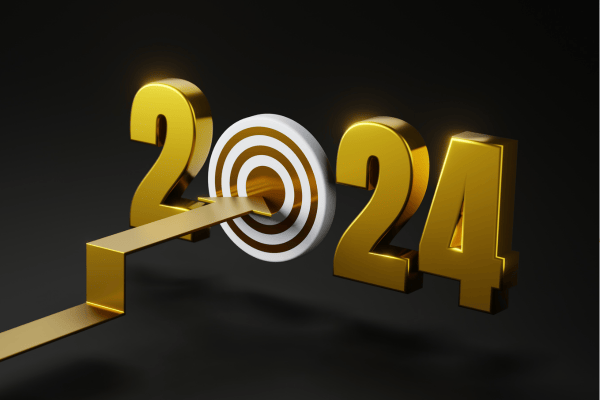 A golden arrow pointing to the year 2024 on a black background, highlighting the potential of gold investment in 2024.